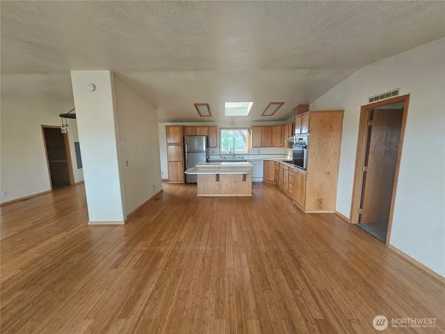 a view of a kitchen from the hallway