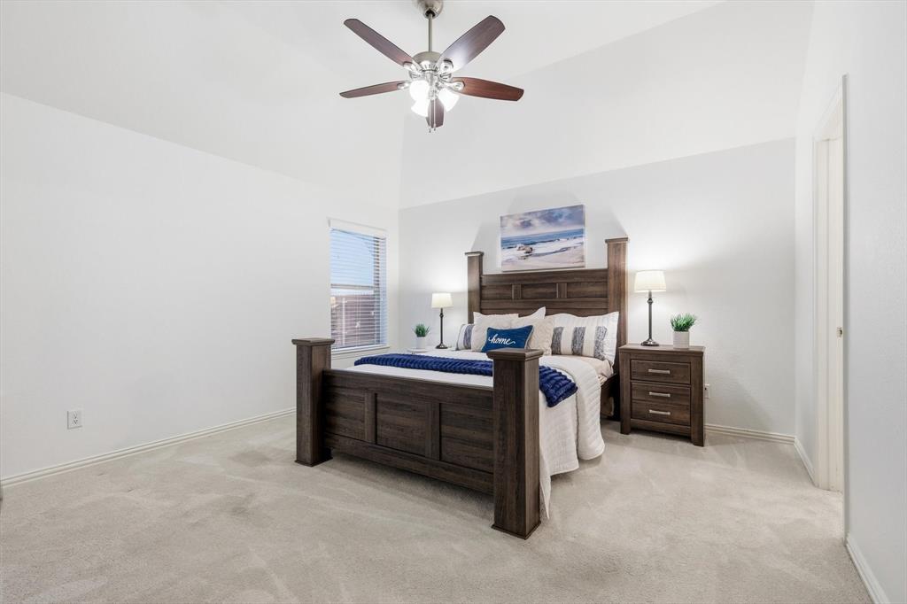 3818 Downing Drive Midlothian, TX 76065 - Photo 11 of 32 Bedroom featuring light carpet, ceiling fan, and lofted ceiling