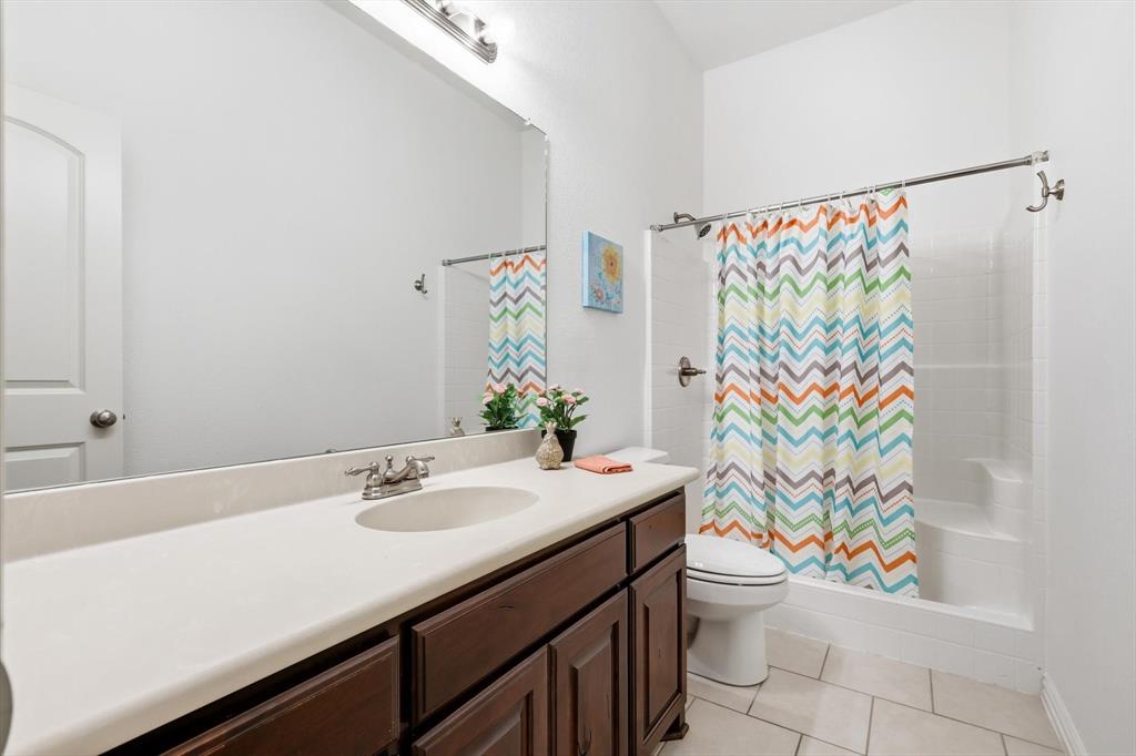 3818 Downing Drive Midlothian, TX 76065 - Photo 18 of 32 Full bath featuring vanity, a stall shower, and light tile patterned flooring