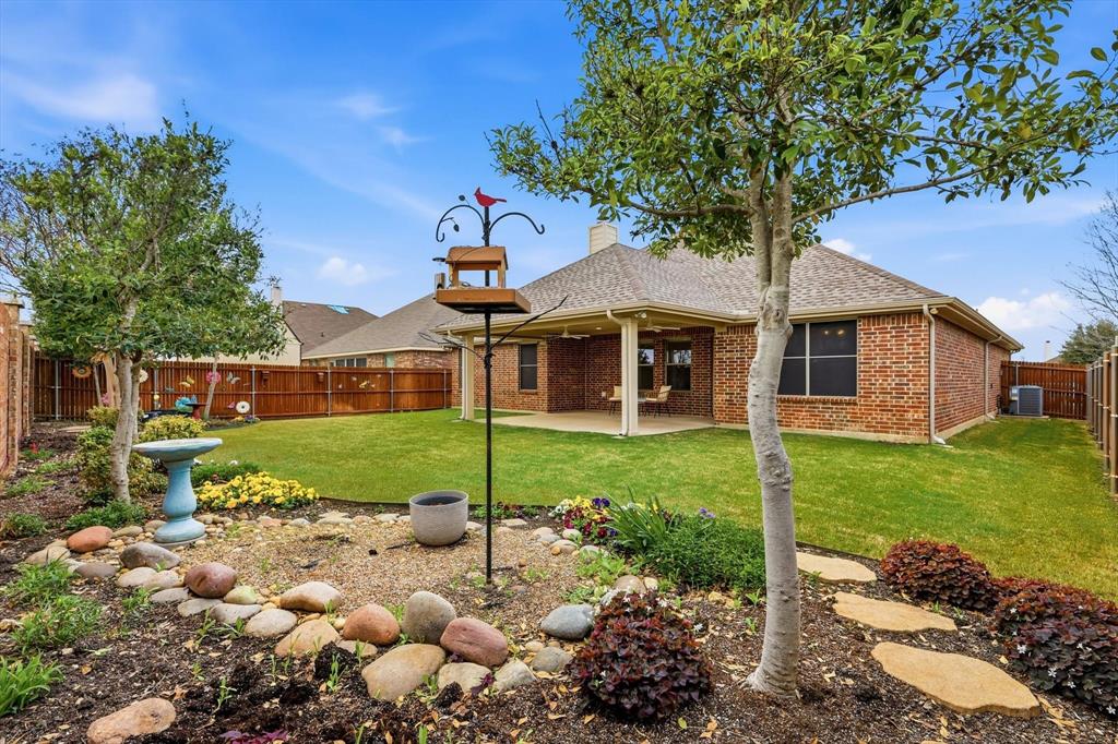 3818 Downing Drive Midlothian, TX 76065 - Photo 2 of 32 Peaceful nights in the backyard featuring a patio, brick siding, a fenced backyard, a chimney, and roof with shingles