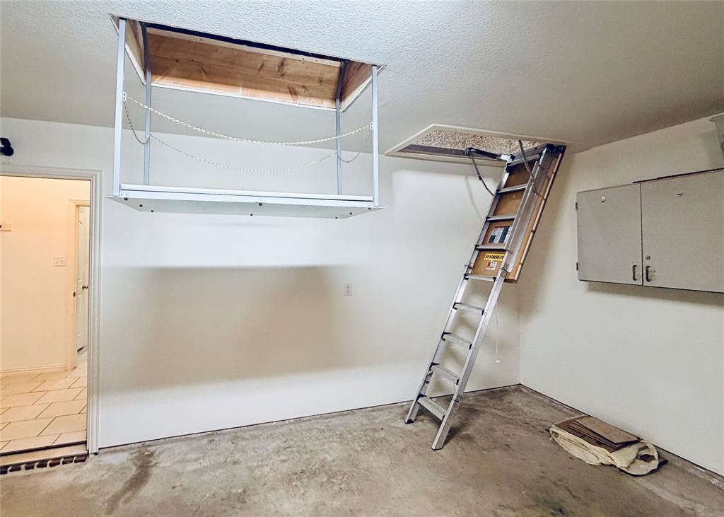 3818 Downing Drive Midlothian, TX 76065 - Photo 22 of 32 Motorized Attic Lift and HD aluminum ladder- attic is fully decked