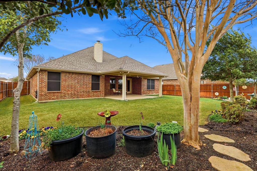 3818 Downing Drive Midlothian, TX 76065 - Photo 24 of 32 Rear view of house with a patio area, a chimney, roof with shingles, a fenced backyard, and brick siding