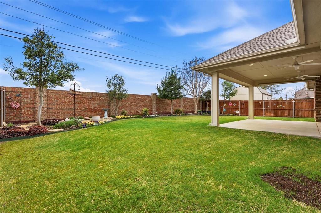 3818 Downing Drive Midlothian, TX 76065 - Photo 26 of 32 Fenced backyard with a patio area and a ceiling fan