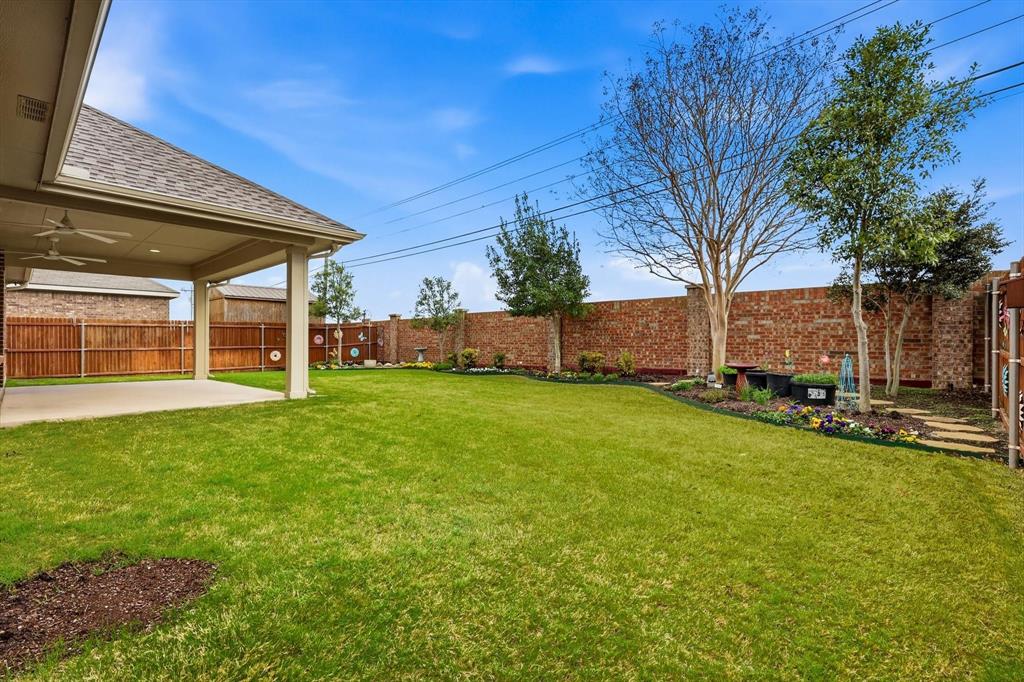 3818 Downing Drive Midlothian, TX 76065 - Photo 27 of 32 Fenced backyard featuring a patio and a ceiling fan