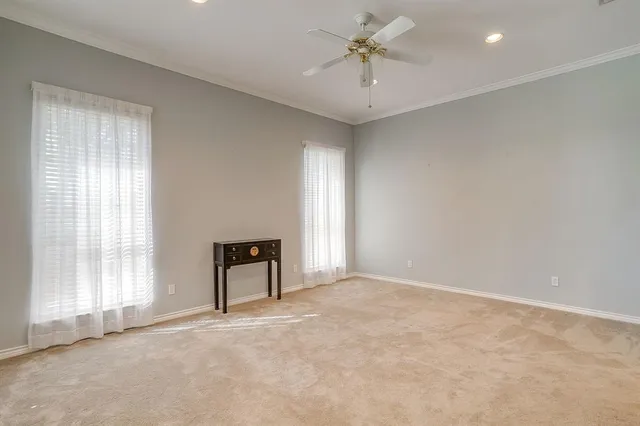 an empty room with a empty space and windows