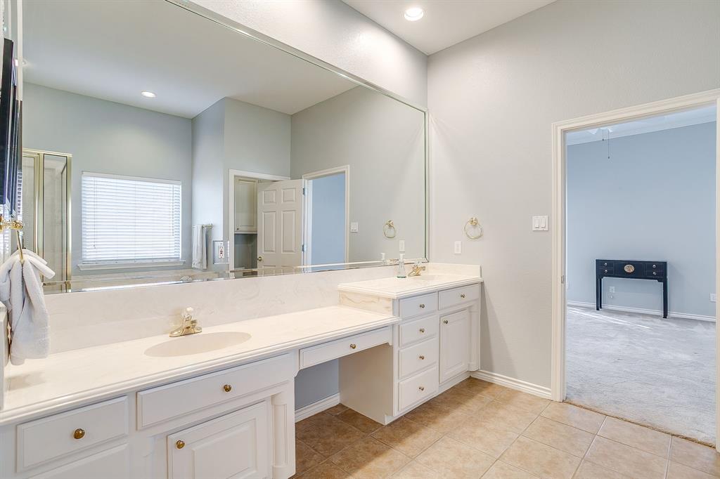 8700 Bellechase Road Granbury, TX 76049 - Photo 20 of 30 a bathroom with a sink double vanity and a mirror