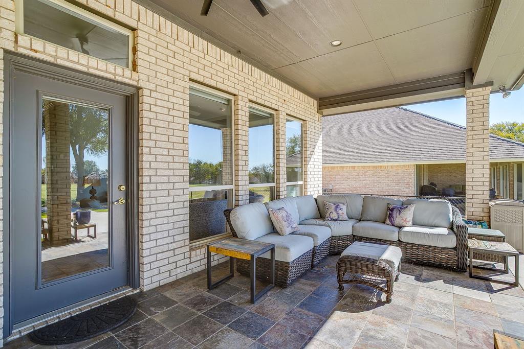 8700 Bellechase Road Granbury, TX 76049 - Photo 27 of 30 a outdoor living space with furniture and a potted plant