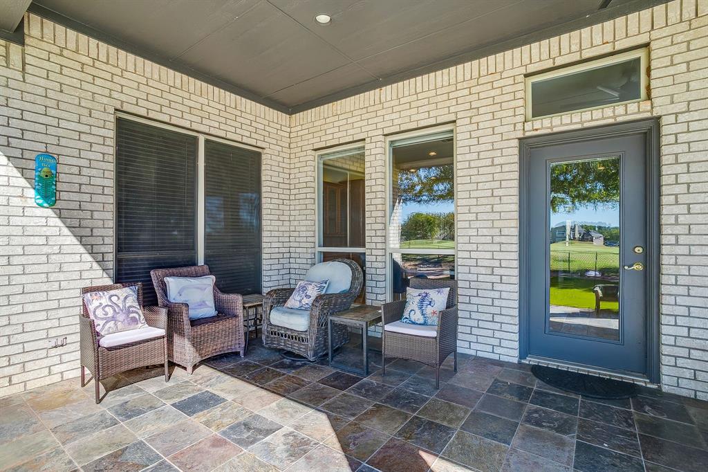 8700 Bellechase Road Granbury, TX 76049 - Photo 28 of 30 a view of a patio with couple of chairs and a barbeque