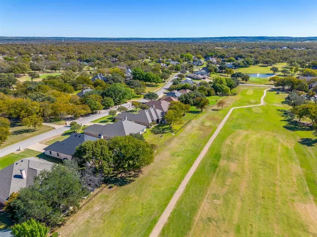 an aerial view of residential houses with swimming pool