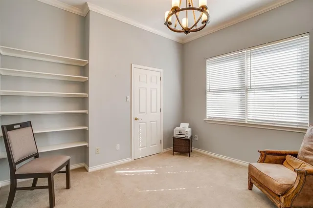 a view of a livingroom with furniture and a window