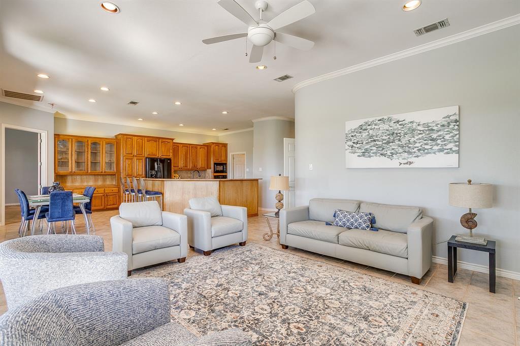 8700 Bellechase Road Granbury, TX 76049 - Photo 10 of 30 a living room with furniture and white walls
