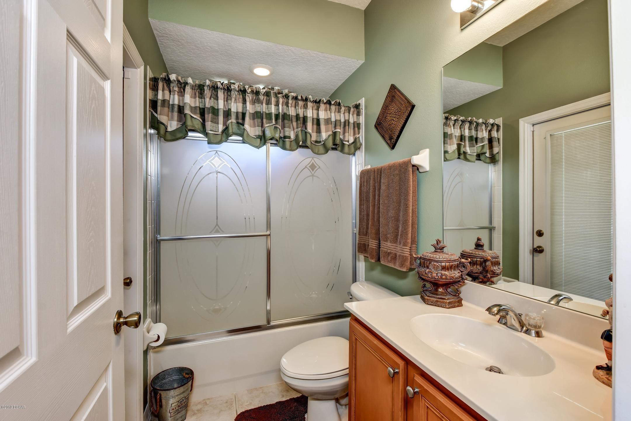 207 Crystal Ridge Road DeLand, FL 32720 - Photo 22 of 39 22-Pool Area Bath