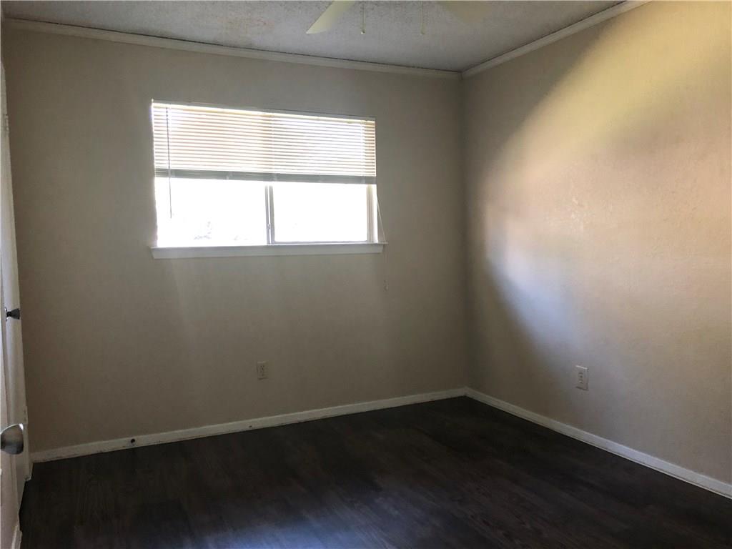 6211 Sunkist Lane Austin, TX 78749 - Photo 5 of 8 Room with dark wood-finish flooring, light-toned walls, and a white ceiling