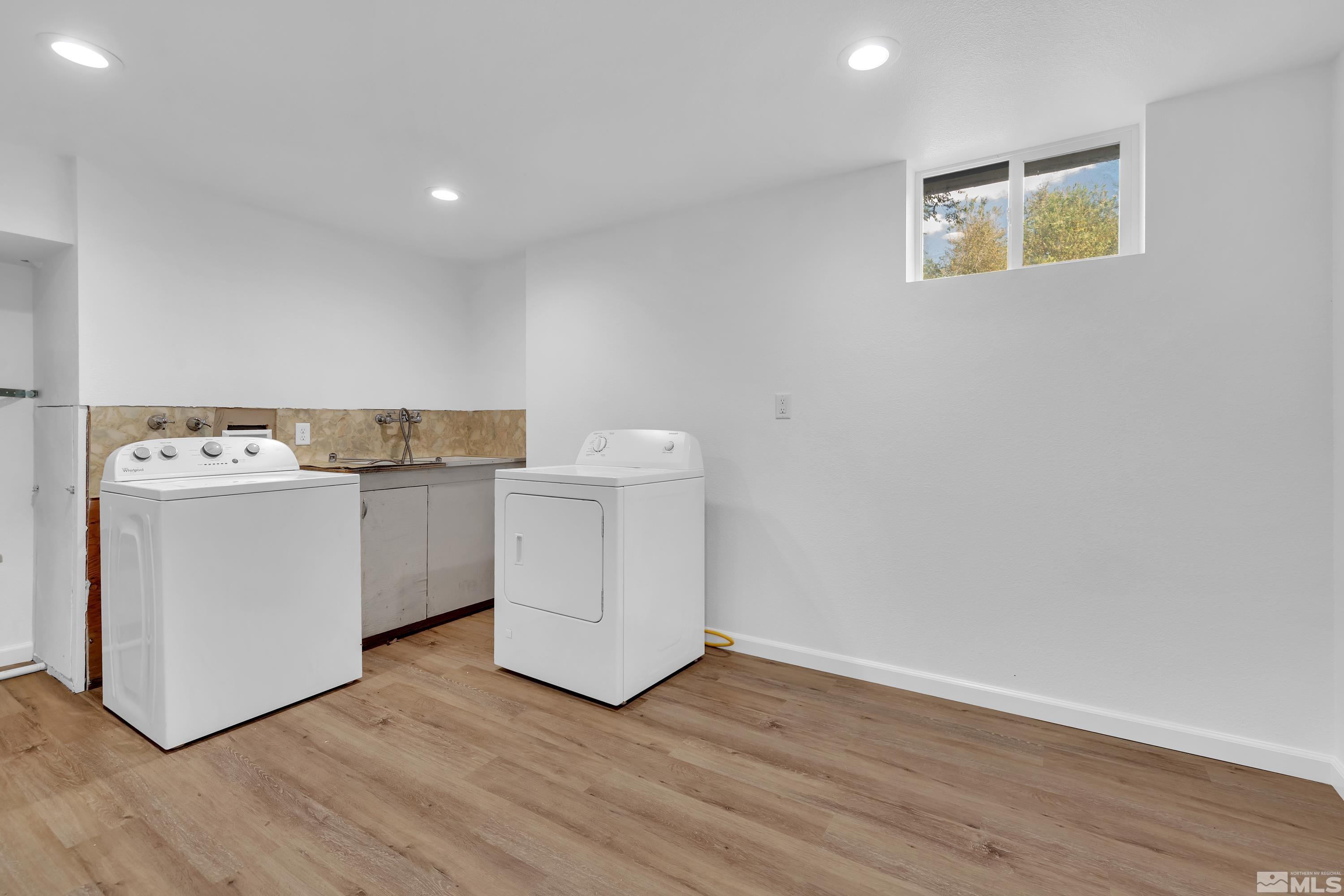840 Lodge Avenue Reno, NV 89503 - Photo 14 of 19 a utility room with wooden floor washer dryer and wooden floor