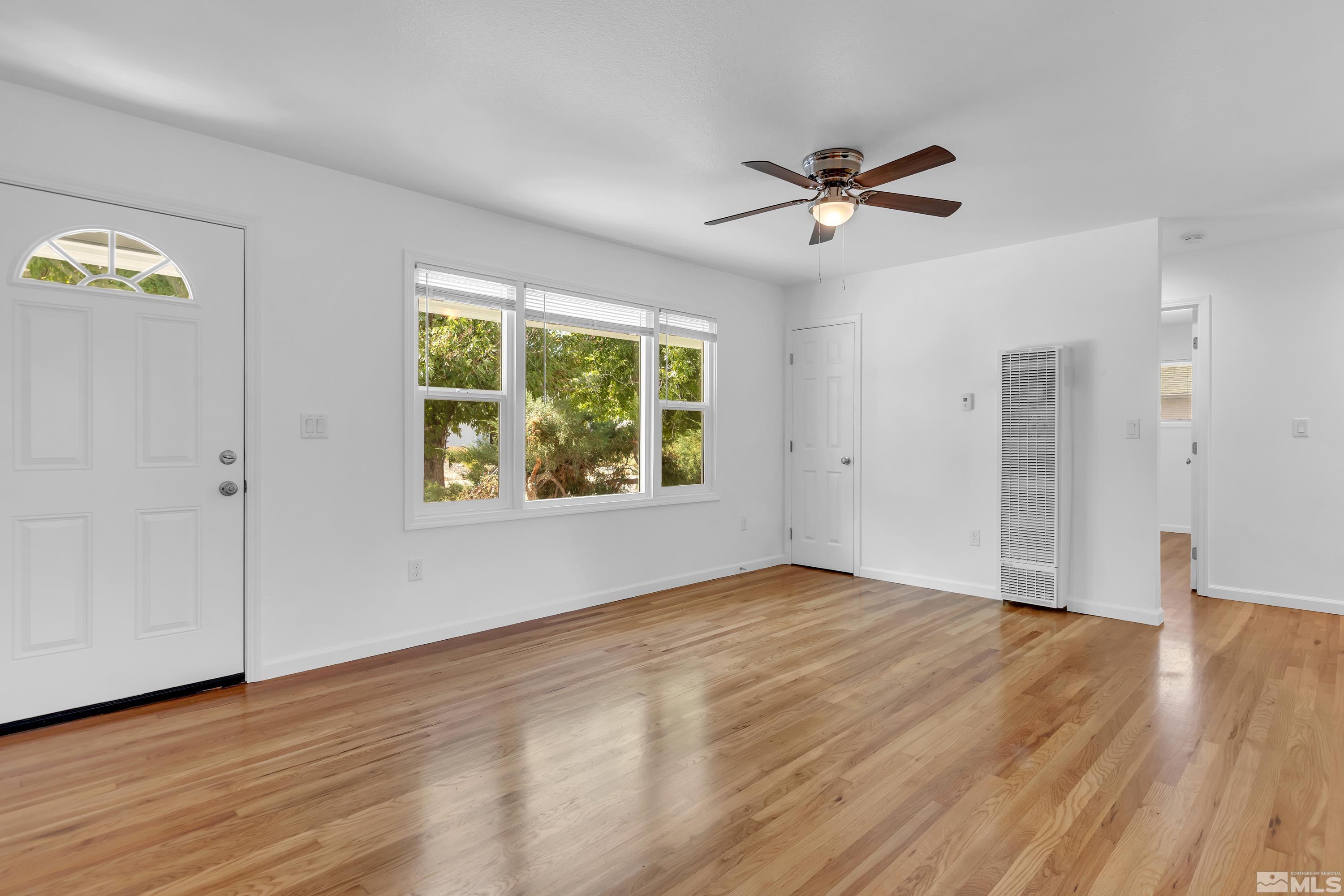 840 Lodge Avenue Reno, NV 89503 - Photo 3 of 19 a view of empty room with wooden floor and fan