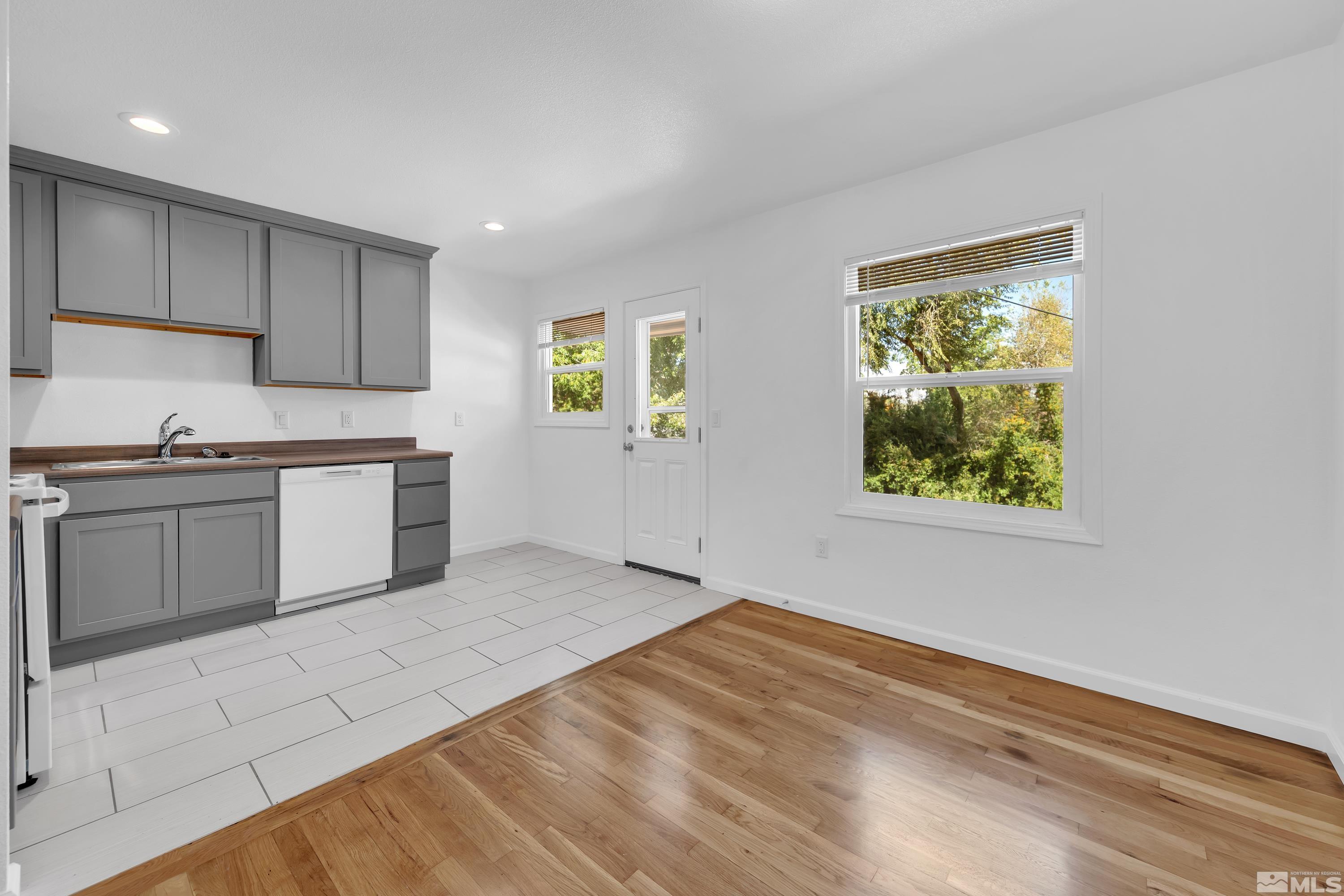 840 Lodge Avenue Reno, NV 89503 - Photo 6 of 19 a kitchen with stainless steel appliances granite countertop a stove a sink and a microwave