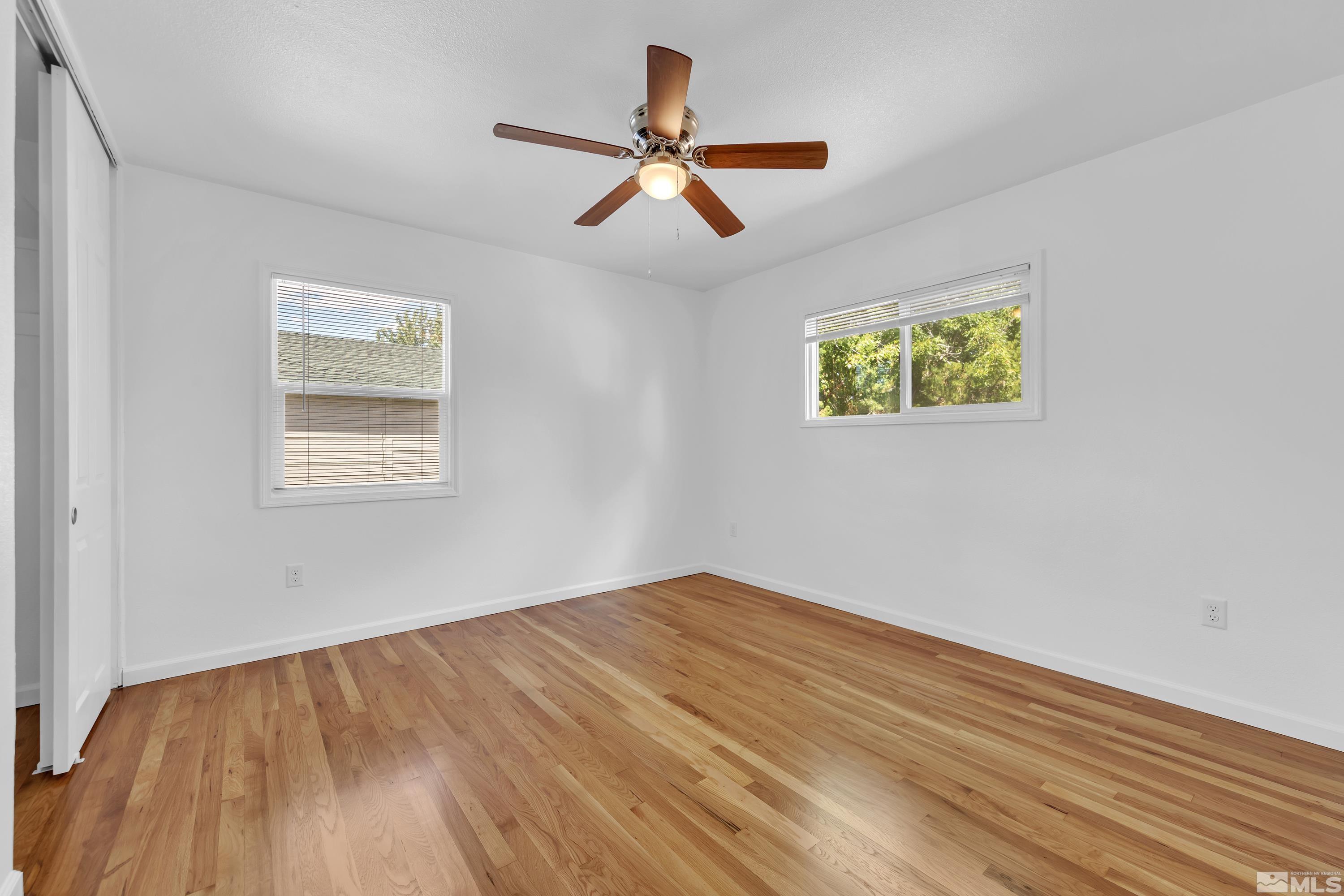 840 Lodge Avenue Reno, NV 89503 - Photo 7 of 19 a view of empty room with wooden floor