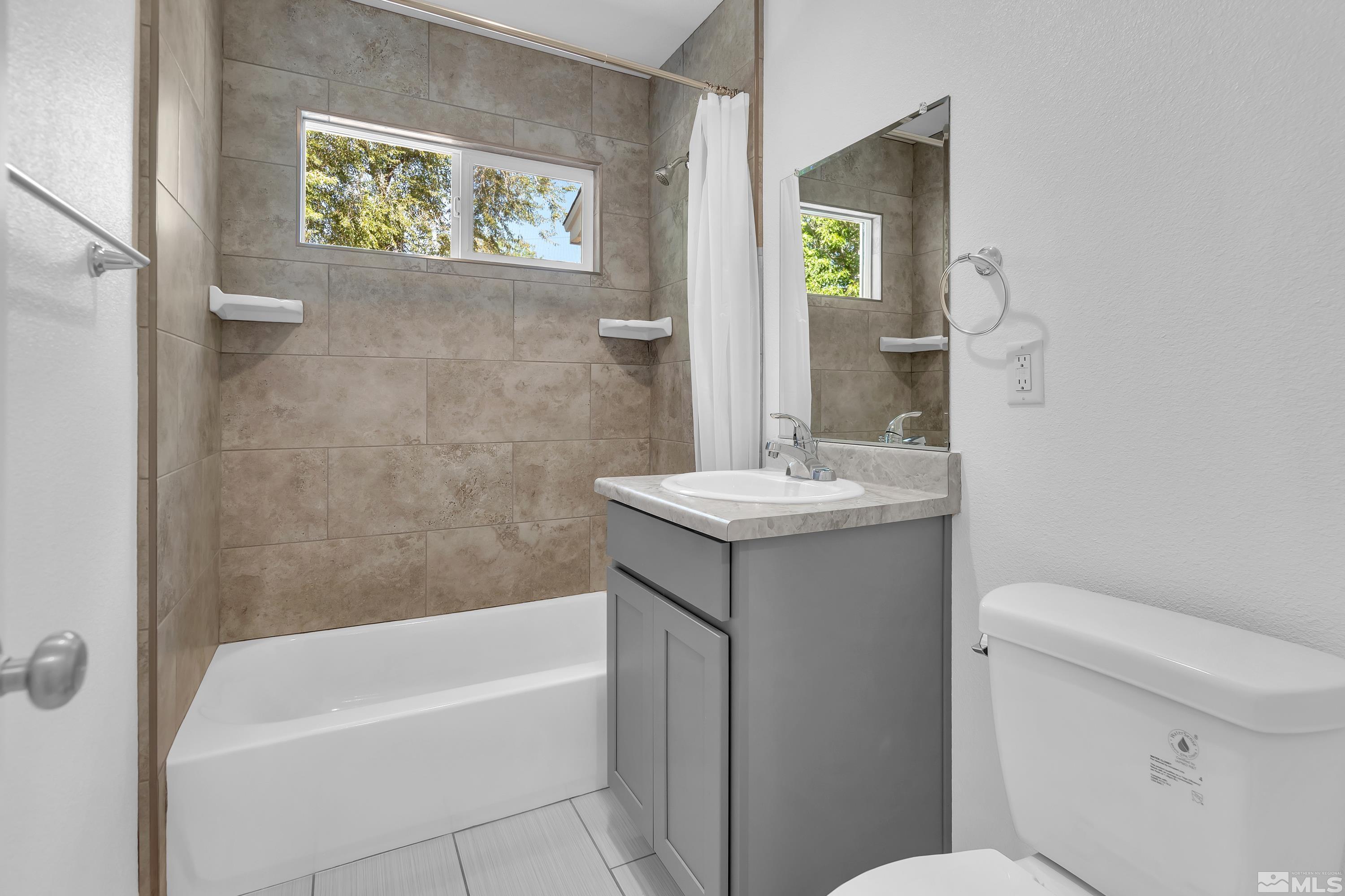840 Lodge Avenue Reno, NV 89503 - Photo 9 of 19 a bathroom with a sink and a mirror