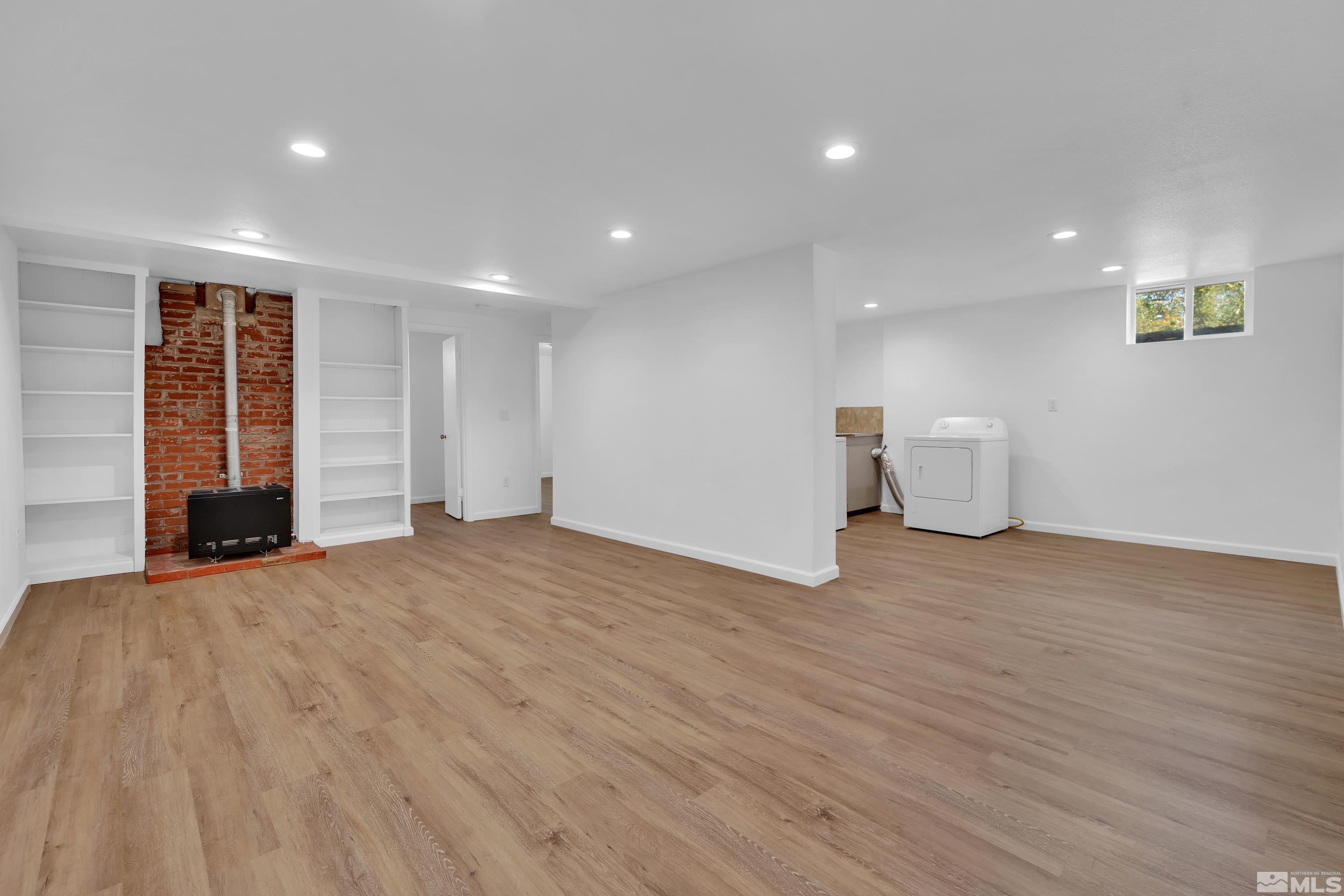 840 Lodge Avenue Reno, NV 89503 - Photo 10 of 19 a view of empty room with wooden floor and window