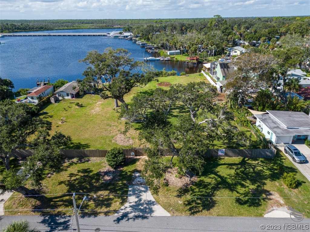 5948 Riverside Drive Port Orange, FL 32127 - Photo 6 of 27 a view of a lake with a houses