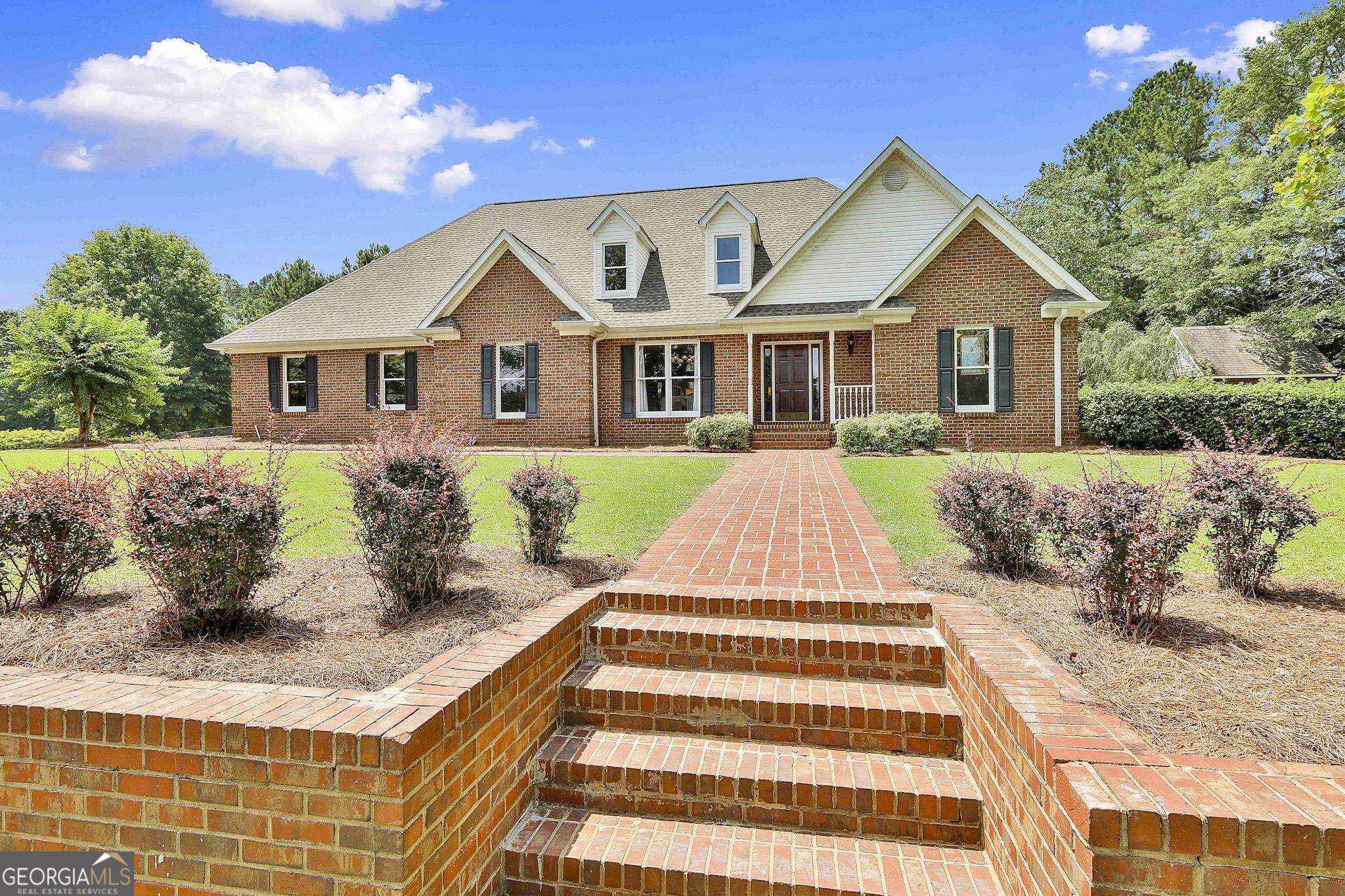 217 Welcome Arnco Road Newnan, GA 30263 - Photo 1 of 1 a front view of a house with a yard