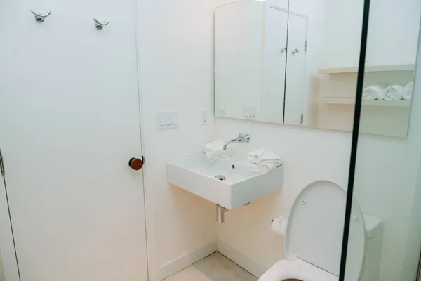 a bathroom with a sink toilet and shower