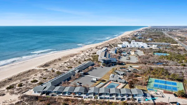 an aerial view of beach and ocean