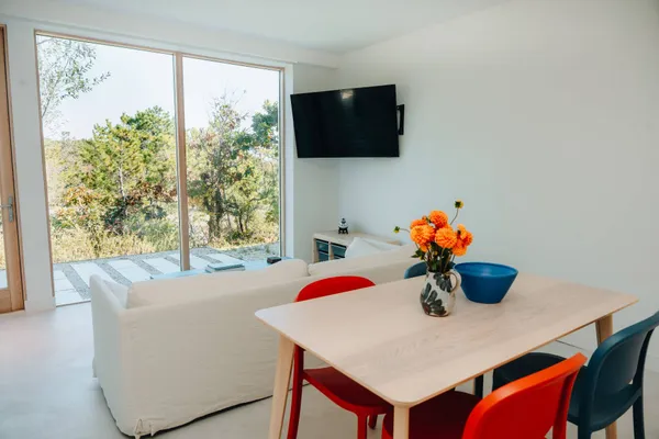 a view of a dining room with furniture and window