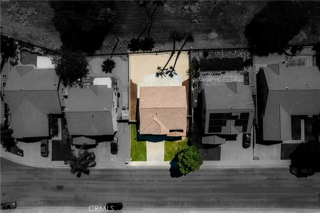 an aerial view of houses with yard