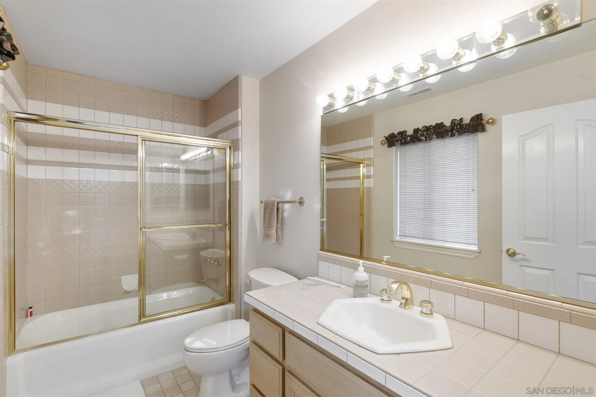 13739 Shadowood Lane Valley Center, CA 92082 - Photo 27 of 37 a bathroom with a sink toilet tub and shower