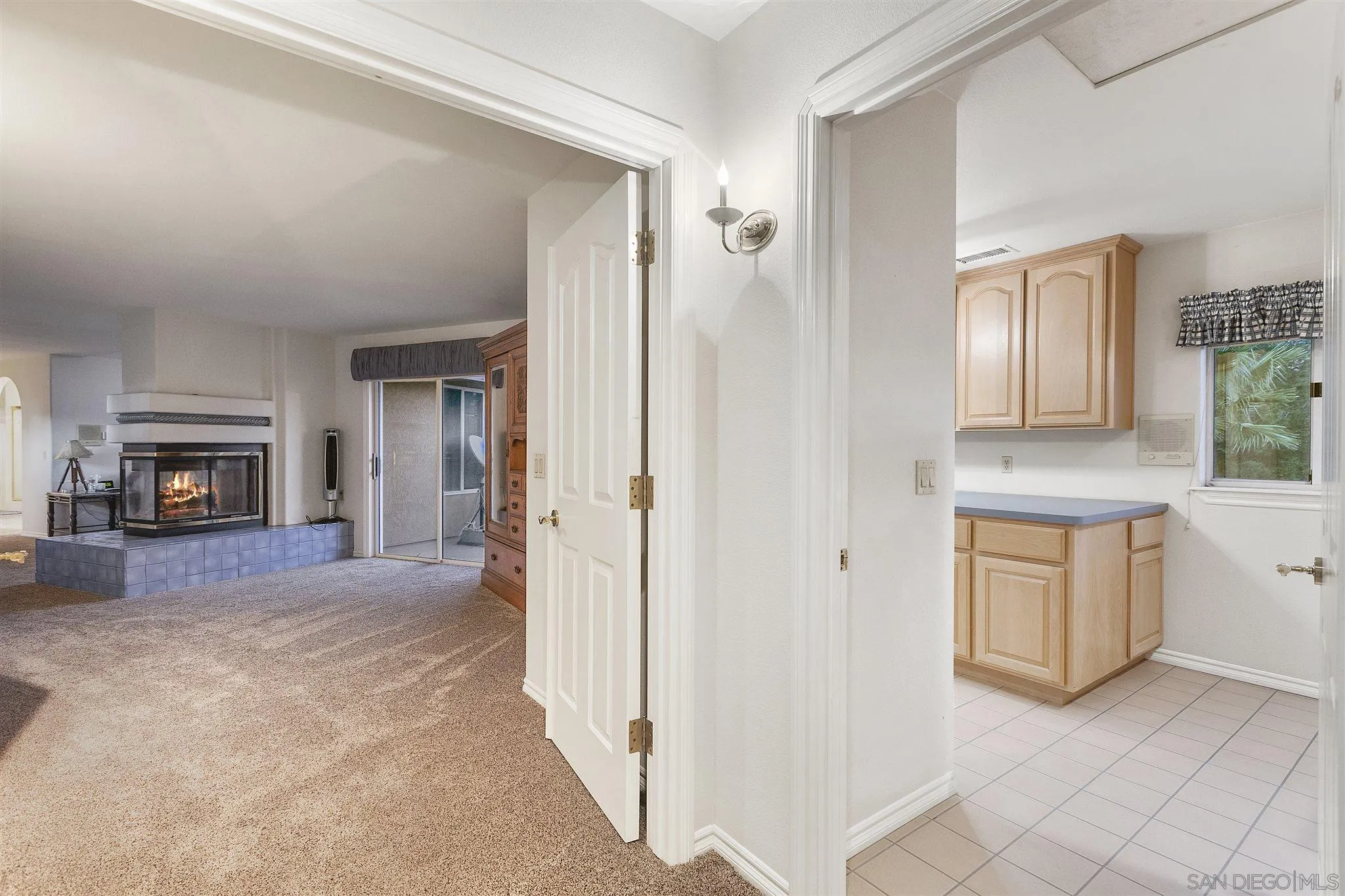 13739 Shadowood Lane Valley Center, CA 92082 - Photo 31 of 37 a view of a hallway with washer and dryer