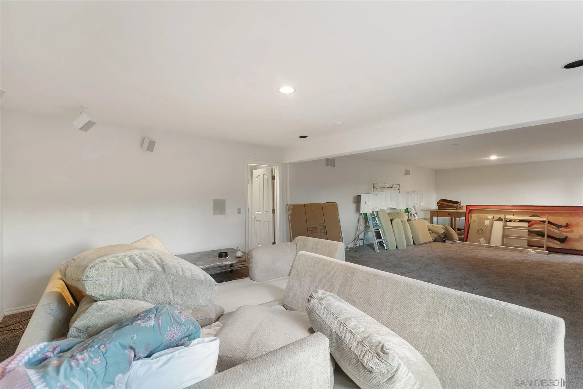 13739 Shadowood Lane Valley Center, CA 92082 - Photo 36 of 37 a living room with furniture and a flat screen tv