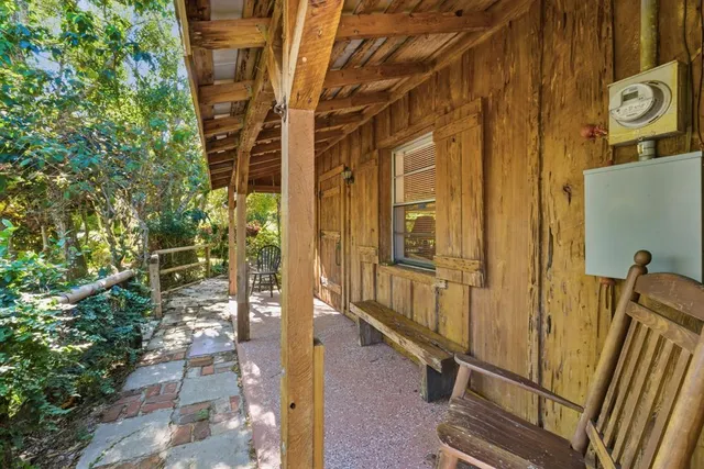 a bedroom with a bed and a table in it