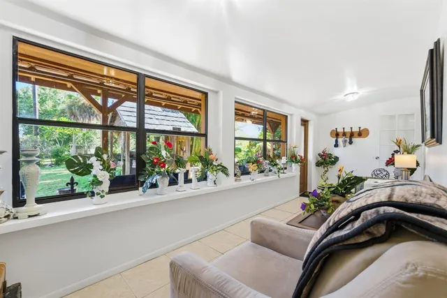 a kitchen with granite countertop stainless steel appliances cabinets a sink and a large window