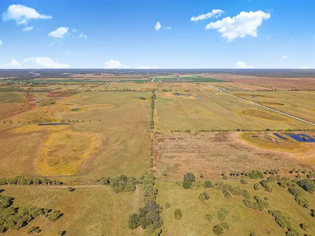 a view of a swimming pool and an outdoor seating