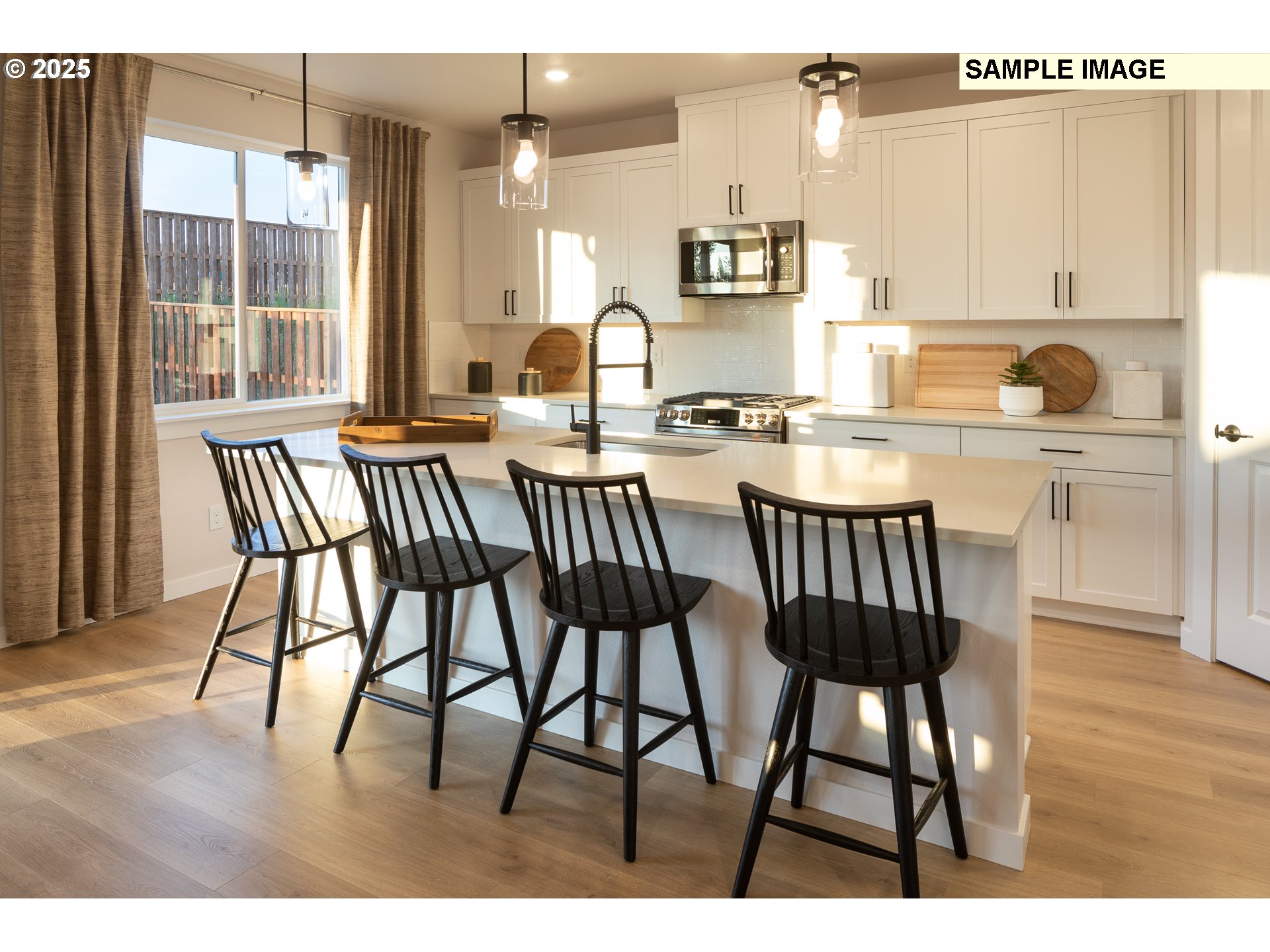 3799 Southwest 37th Street Gresham, OR 97080 - Photo 4 of 14 a kitchen with a table chairs and a view of living room