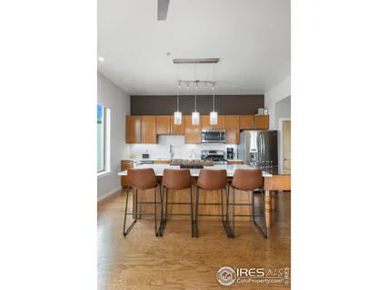 a dining room with table and chairs