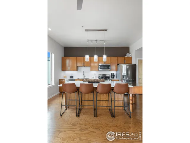 a dining room with table and chairs