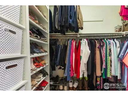 a bedroom with furniture and a book shelf