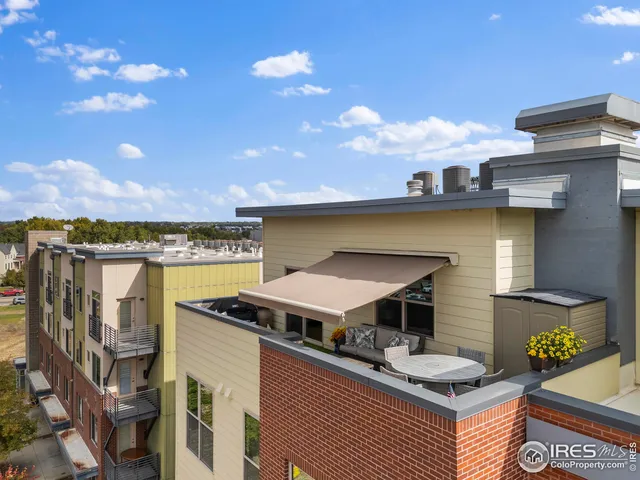 a front view of a building with street view and glass windows