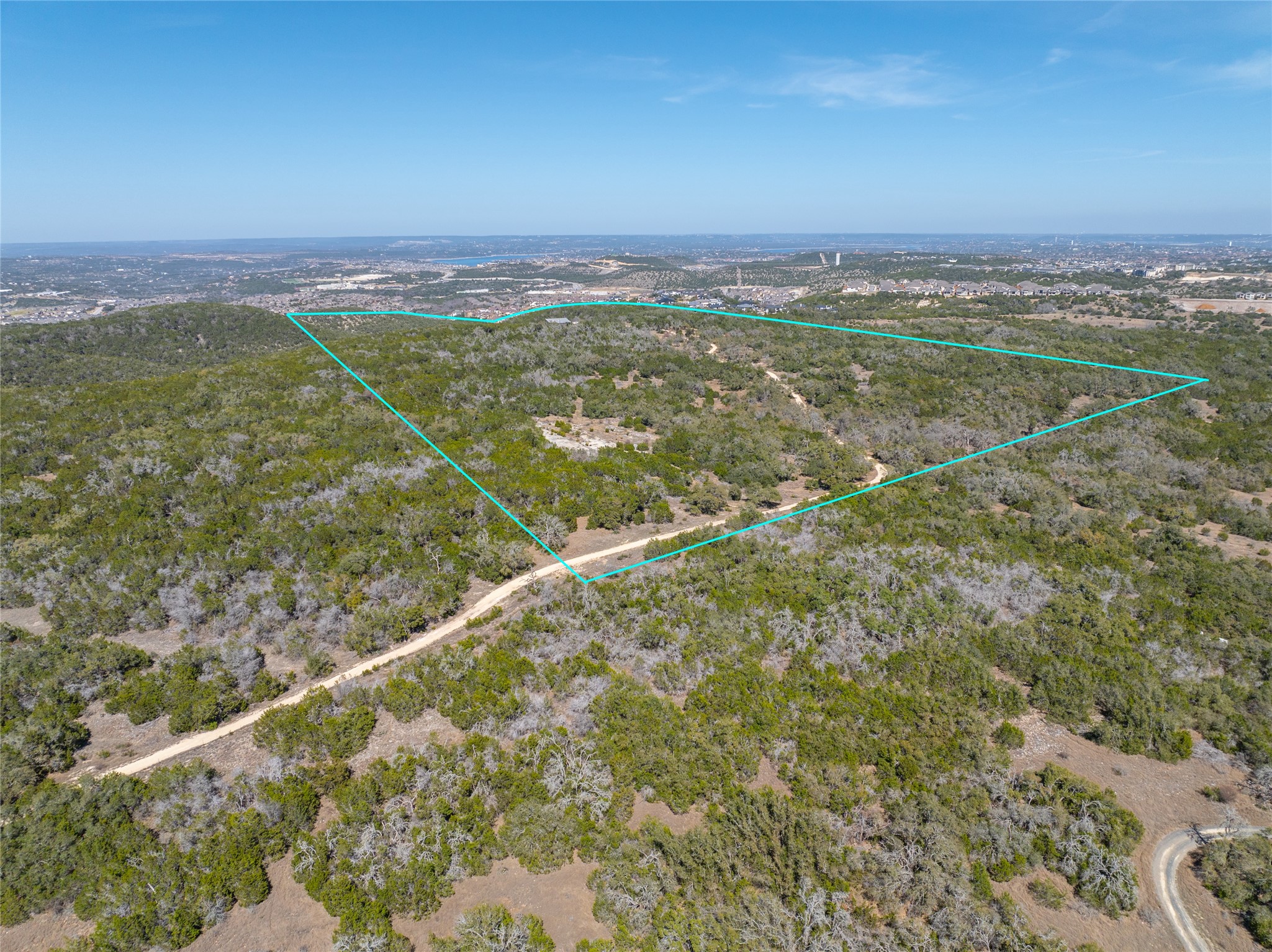 17318 Hamilton Pool Road Austin, TX 78738 - Photo 4 of 21 Rolling hills and dense greenery define this sweeping acreage with distant city views.