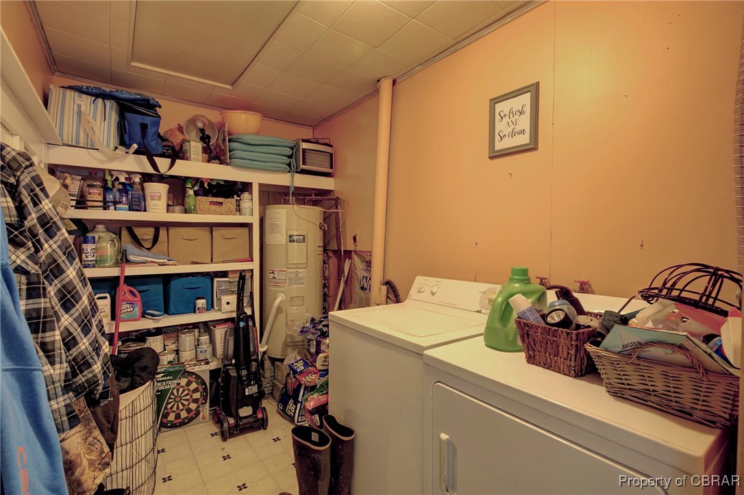 954 Carlton Road Wake, VA 23176 - Photo 20 of 25 Laundry area with electric water heater and separate washer and dryer