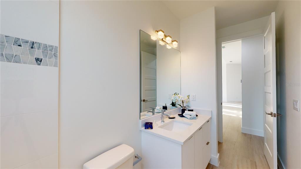 10510 Rainsville Street Port Charlotte, FL 33981 - Photo 25 of 37 a bathroom with a sink vanity and toilet