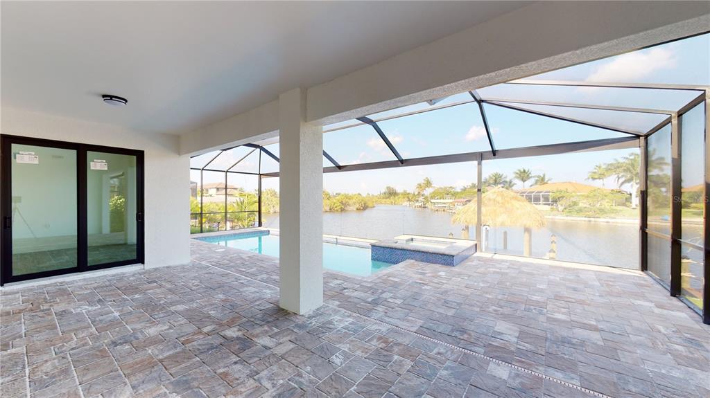 10510 Rainsville Street Port Charlotte, FL 33981 - Photo 35 of 37 a view of an empty room with a floor to ceiling window and a yard