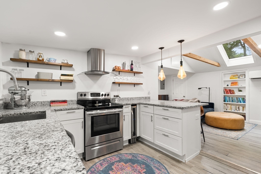 a kitchen with stainless steel appliances granite countertop a stove and a sink