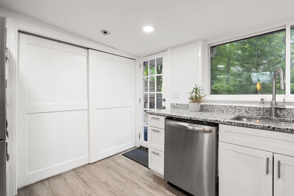47 South Shore Road Holbrook, MA 02343 - Photo 12 of 30 a kitchen with stainless steel appliances granite countertop a refrigerator sink and cabinets
