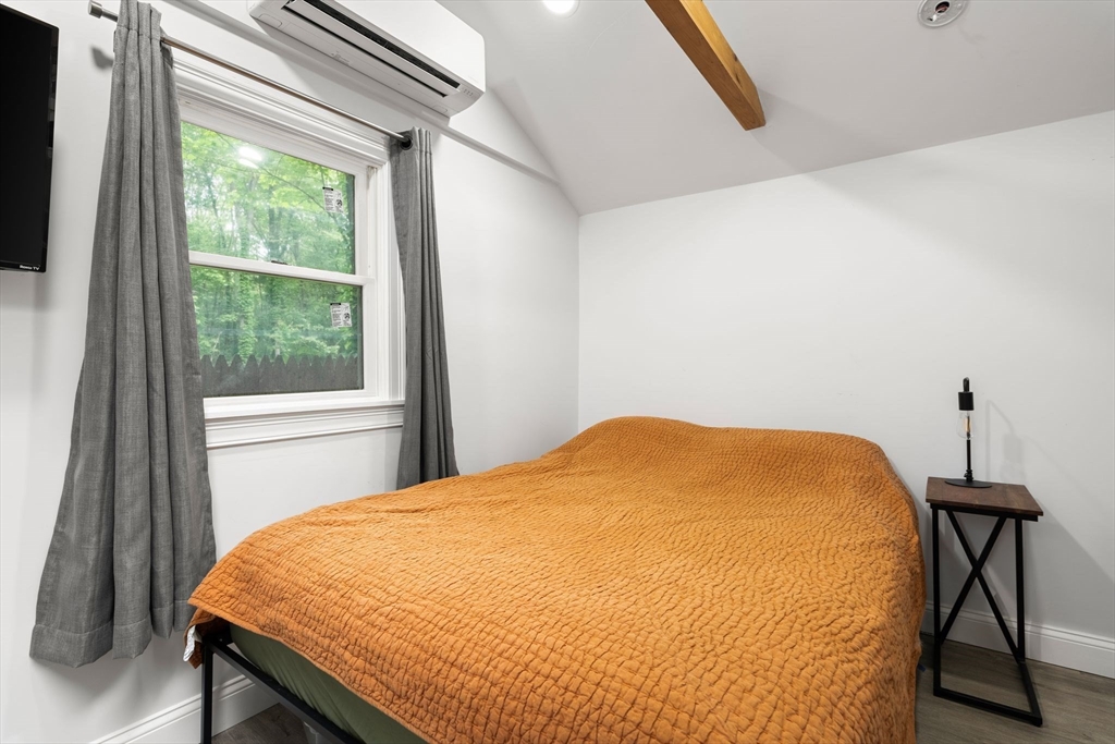 47 South Shore Road Holbrook, MA 02343 - Photo 15 of 30 a bed sitting in a bedroom next to a window