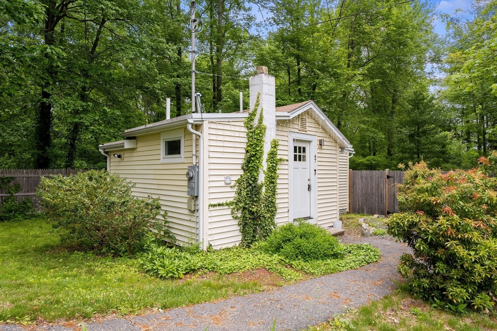 47 South Shore Road Holbrook, MA 02343 - Photo 23 of 30 a view of a house with a yard and plants