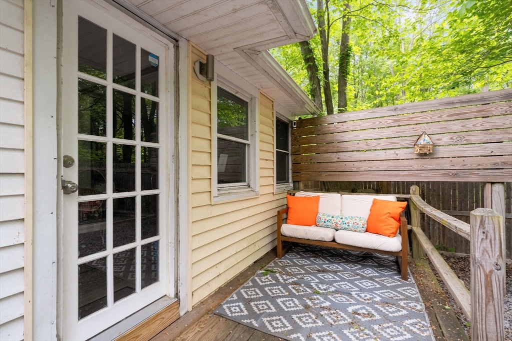 47 South Shore Road Holbrook, MA 02343 - Photo 24 of 30 a blue bench sitting in front of a house