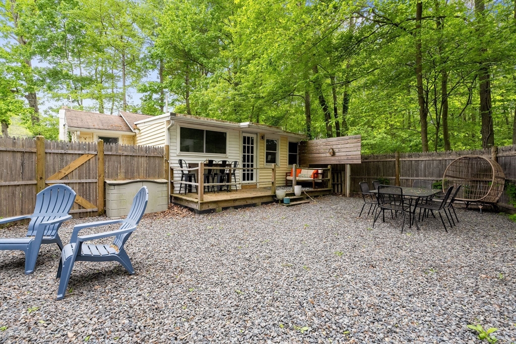 47 South Shore Road Holbrook, MA 02343 - Photo 27 of 30 a backyard of a house with table and chairs